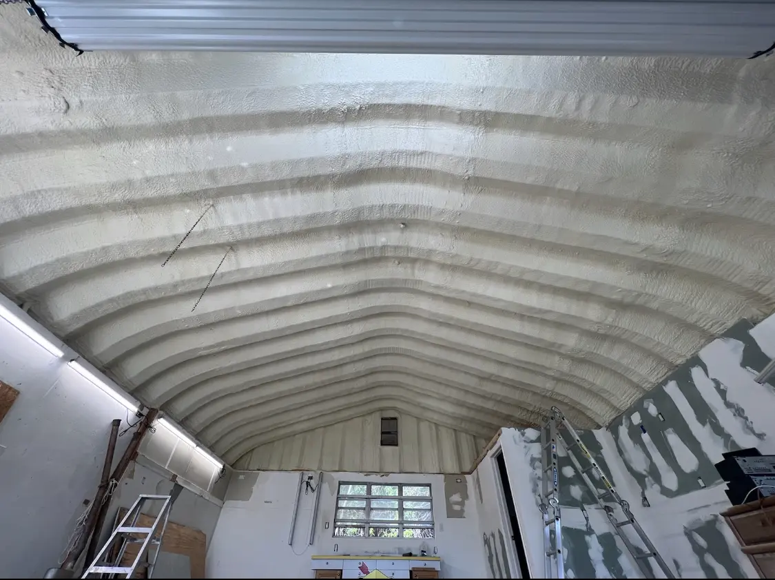 Spray polyurethane foam applied to the underside of a metal roof deck in Wilmore